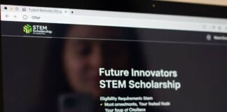 Scholarships Every Woman in STEM Should Apply For A blurry image of a laptop screen with a STEM scholarship site and a sticky note that reads "You Got This, Idiot."