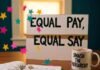 Understanding Feminist Policy in Today’s Political Climate "Feminist desk with 'Equal Pay, Equal Say' sign and 'Smash the Patriarchy' mug.""Feminist desk with 'Equal Pay, Equal Say' sign and 'Smash the Patriarchy' mug."