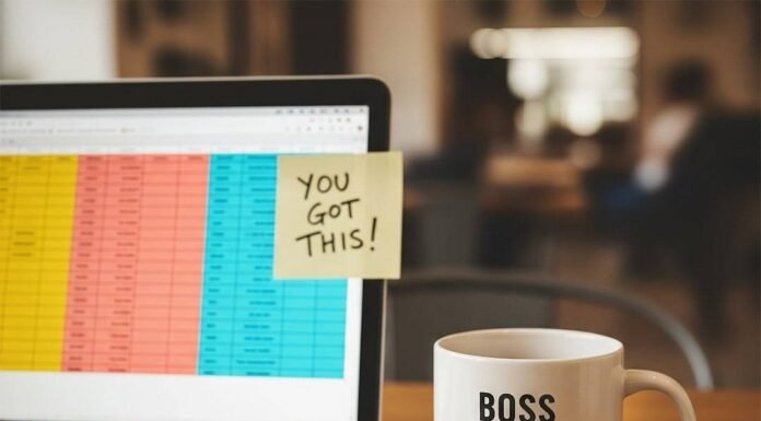 How to Start a Business as a Woman—Without Burning Out A laptop, mug, and paperclips on a table, with a "You Got This!" note.